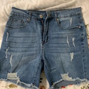 Stretchy distressed denim shorts